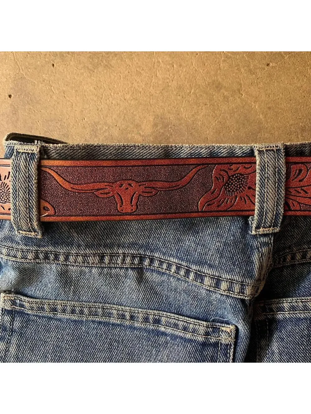 American Western Brown leather belt with silver-toned brass buckle, featuring a